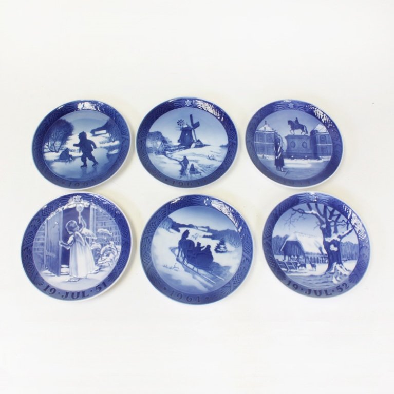 Set of 6 Royal Copenhagen Plates: Est $ 200-300 Royal Copenhagen, Hans H. Hansen blue and white plates. The dates on the plates include: 19 July 52, 1964, 19 July 51, 1954, 1963 and 1965. The reverse of the plates bear a wire attachme
