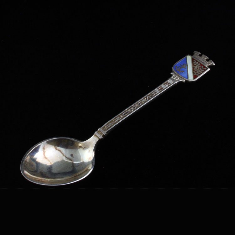 David-Andersen Sterling & Enamel Demitasse Spoon: Est $ 50-90 Sterling demitasse spoon made by David-Andersen with Porsgrunn written across the transition terminiating into the Porsgrunn coat of arms. The reverse of the handle is marked with David-An