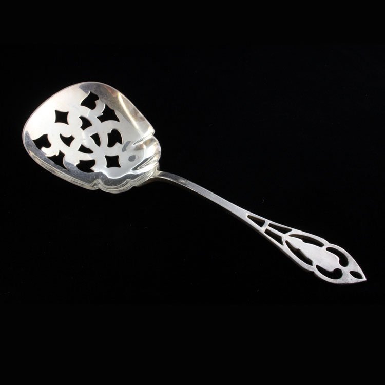 Sterling Manchester Silver Co. Bon Bon Spoon: Est $ 60-100 Sterling bon bon spoon made by Manchester Silver Co. with the 1951 Pierced Handle pattern. The spoon is marked silver and bears the crown and cross makers mark for the Manchester Silver C