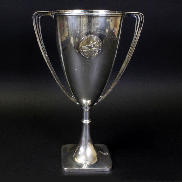 Sterling Horse Show Trophy: Est $ 500-600 Sterling horse show trophy marked by Bailey, Banks & Biddle. The trophy is engraved "1912 West Jersey Horse Show, Won by Lady Grace", the middle of the trophy has a medallion depicting a