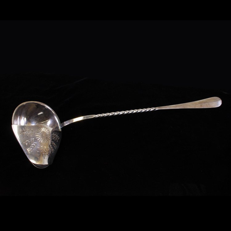 Large Christofle Silverplate Punch Ladle: Est $ 100-200 Large French silverplate punch ladle with a spiral twist handle and a pierced hood. The reverse of the handle is marked Christofle with his makers mark next to it. The ladle measures 16"