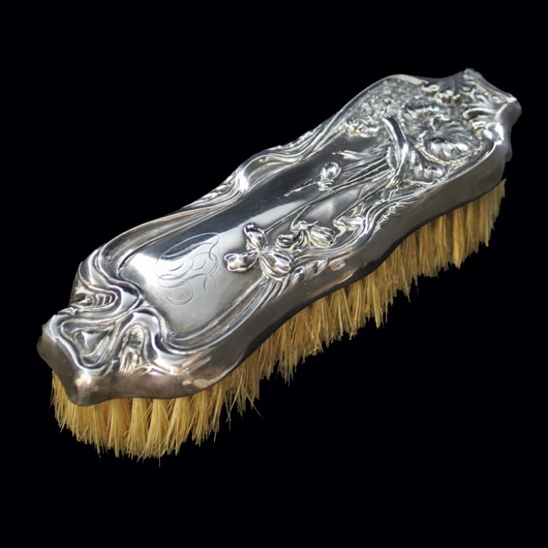 Vintage Simon Brothers Men's Coat Brush: Est. $ 45-70 Vintage Simon Brothers Men's Coat Brush. Woman and floral design, monogrammed LD . Marked Sterling 1900, Pat June 7,04 and has the Simon brothers mark, has a few dents in the sides . 7" l