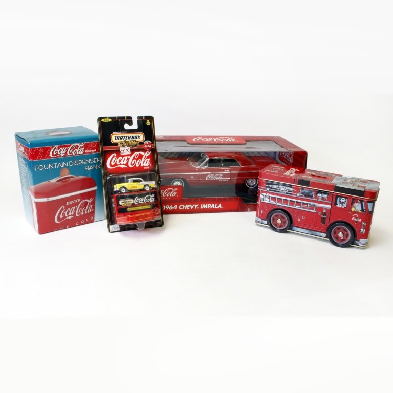 Set of Four Coca-Cola Collectables: Est $ 200-300 Set of four coca-cola collectables including: a 1964 Johnny Lightning Chevy Impala, a Fire truck tin coin bank attached with four spinning wheels, a dinner collection fountain dispenser