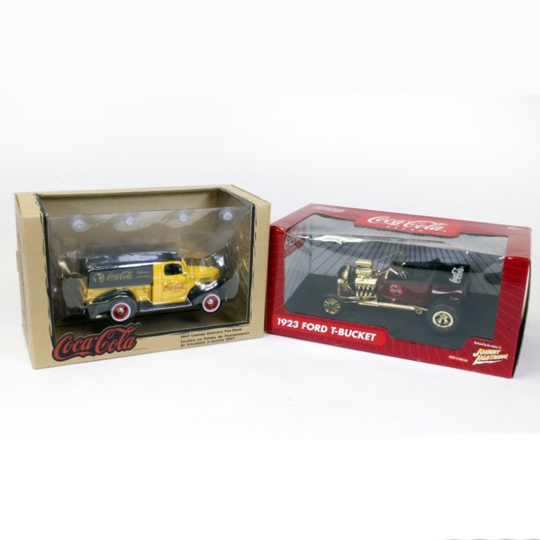 Set of Two Coca-Cola Vehicles: Est $ 200-300 Set of Two Coca-Cola Vehicles, the first is a 1923 Ford T-Bucket Johnny Lightning and a 1947 Canopy Delivery Van Back that comes with toy crates with bottles in them.