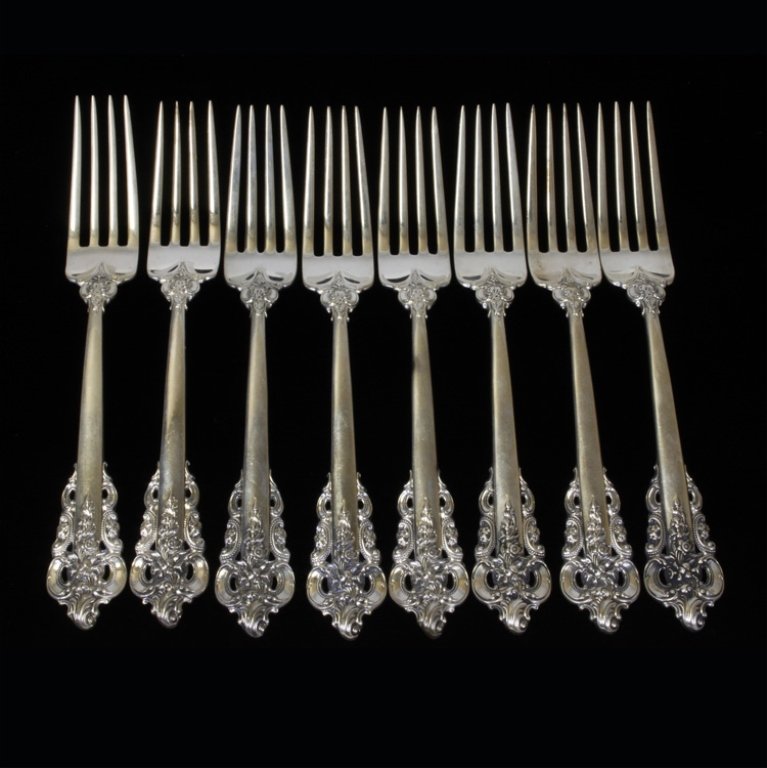 Set of 8 Grande Baroque Wallace Forks: Est $ 600-800 Sterling forks made by Wallace Silversmiths with the1941 Grande Baroque pattern designed by William S. Warren. The forks bear the makers mark and are marked sterling, they measure 7 5/8"
