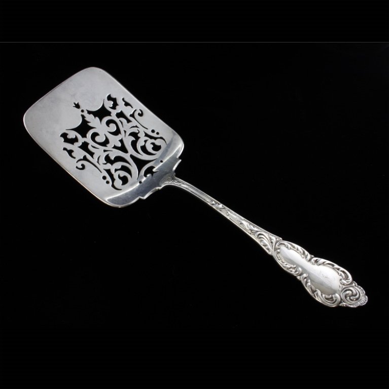 Howard Sterling Co. Pierced Waffle Server: Est $ 100-200 Sterling waffle server marked by the Howard Sterling Co. with the 1892 Lorraine pattern designed by Charles C. Wientage. The server is pierced and is monogrammed with the letter R. 7 7/8