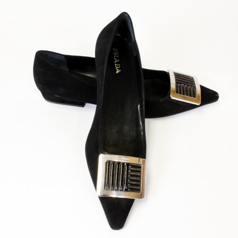 Prada Black Flats: Est. $ 100 - 200 Black flats with silver buckles made in Italy by Prada.Size 41, 11" long, 4' wide with 1" tall heels.