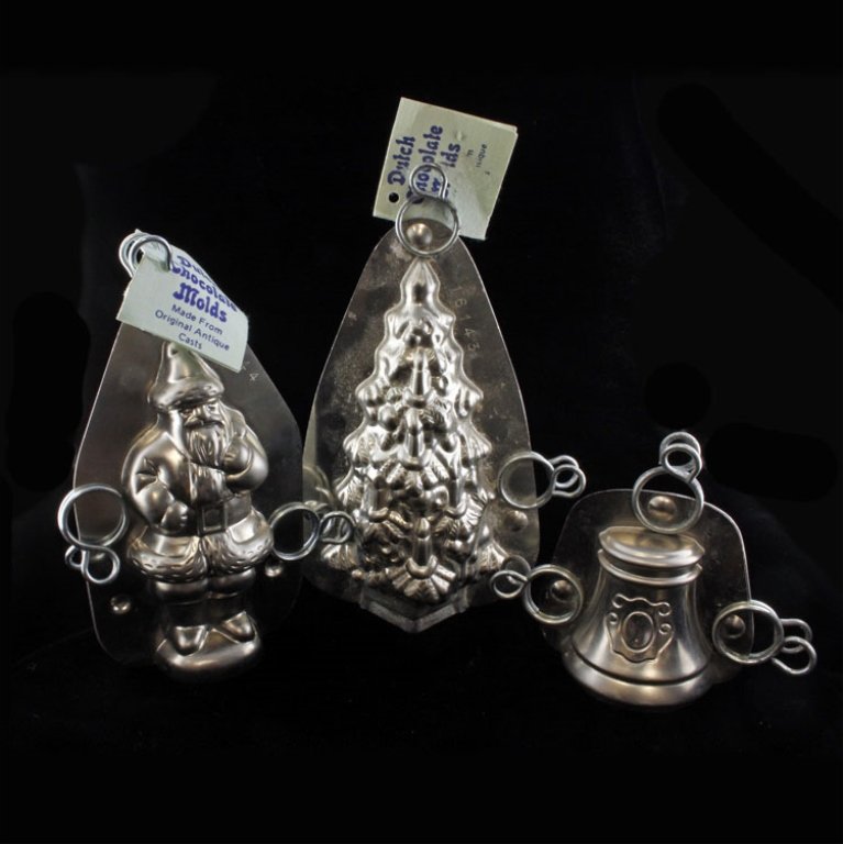 Set of 3 Chocolate Molds: Est. $ 100 - 250 Set of 3 Chocolate Molds (3) Dutch chocolate molds, made in Holland. One Christmas tree 6" tall x 4" at the widest point and 3" deep, one Santa 5" tall x 3" wide x 2" deep, and one in