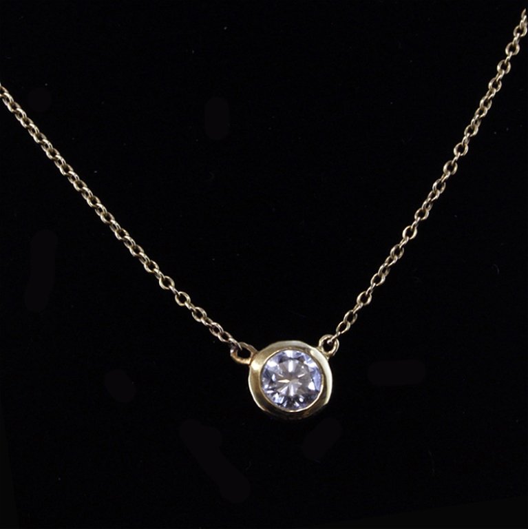 Tiffany & Co Elsa Peretti Diamonds By The Yard: Est. $1250 - 1750 Tiffany & Co Elsa Peretti Diamonds By The Yard Necklace 18K yellow gold 1.68 gr. Diamond: 0.35ct round brilliant, F-G VS. 16" chain. Marks: Tiffany & Co, Peretti