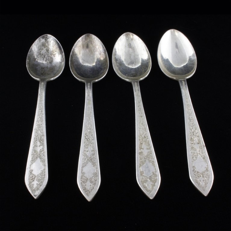 Set of 4 Middle Eastern Spoons: Est $ 80-160 Set of four spoon marked 84 next to an unknown makers marks. The spoons bear a floral etched pattern on the handle and they measure 5 1/4" long x 1 1/8" wide and they weigh 2.8 ozt. The s