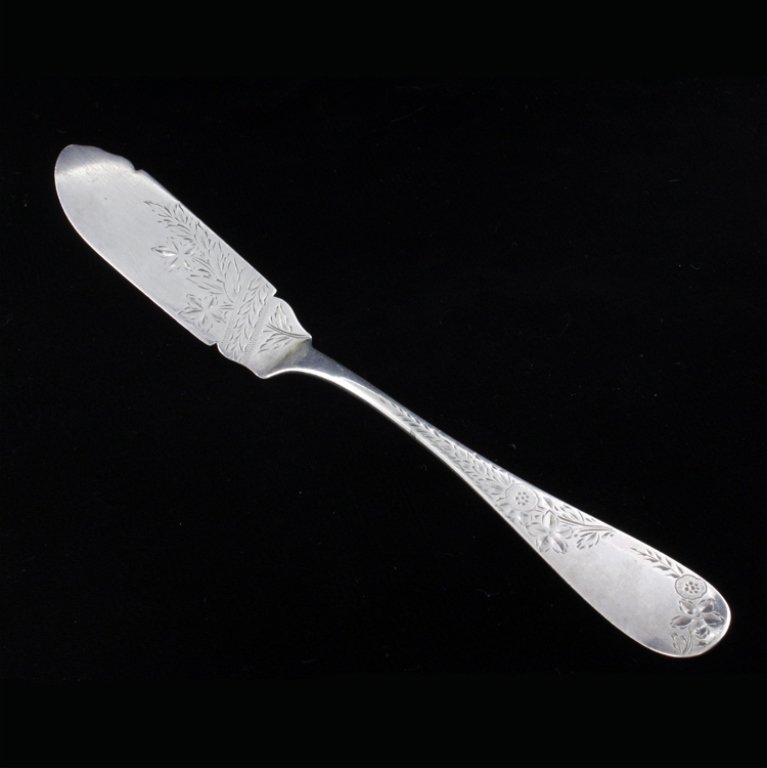 Wm. B Durgin Co. Sterling Master Butter Knife: Est $ 60-120 Master butter knife marked Wm. B Durgin Co., sterling and Potter & Cushing. The knife has a bright cut floral pattern and measures 7 1/4" long x 1" at the widest point. 1.0 ozt.