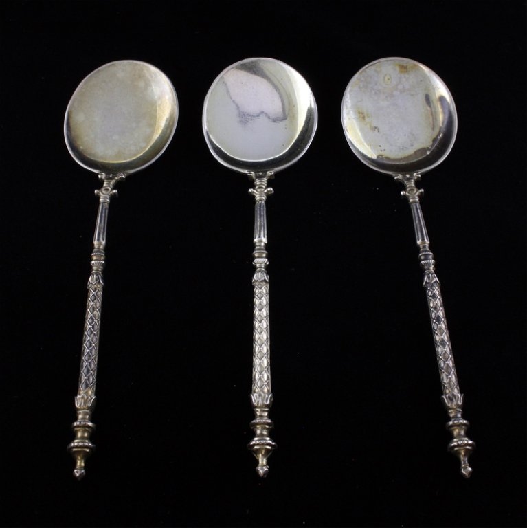 Set of Three .800 Silver German Demitasse Spoons: Est $ 80-160 Set of three demitasse spoons marked .800 and bears a worn German half moon and crown silver mark. 4 5/8" long and they weighs a total of 1.2 ozt. Has minor discoloration.