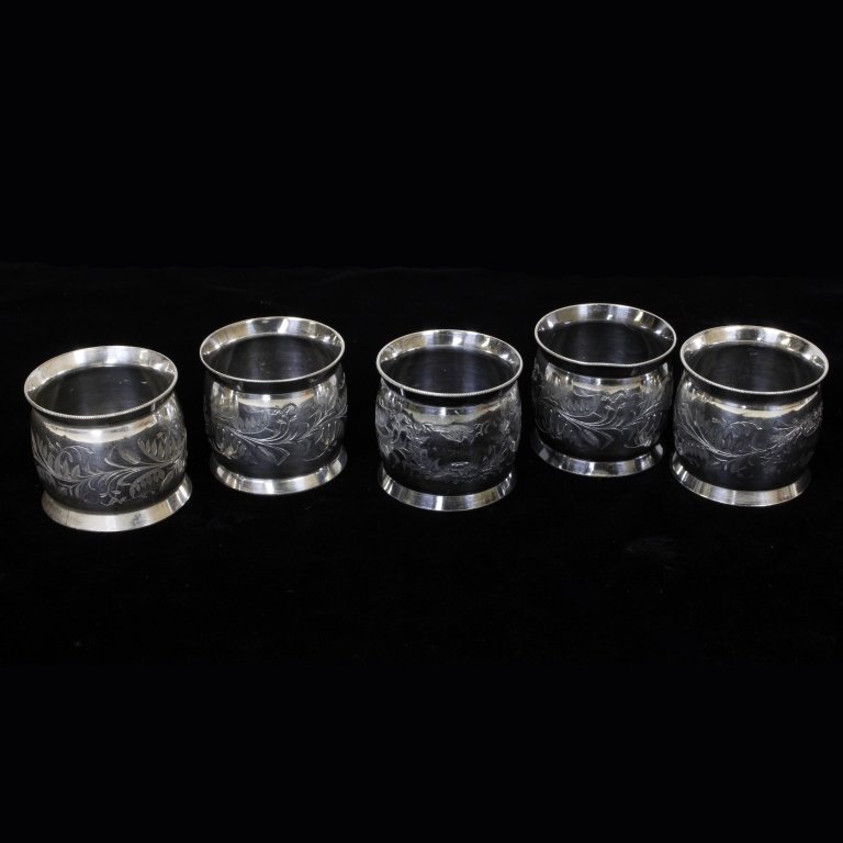 Set of 5 Silver Plated Napkin Rings: Est $ 40-90 Set of 5 silver plated napkin rings with etched floral and birds motifs. No makers or maker marks observed, minor discoloration and one of the rings is dented on the lip. They measure 1 5/