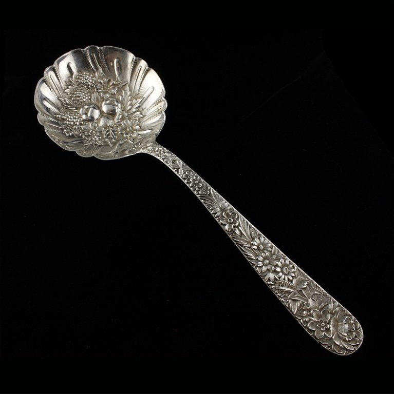 Sterling Kirk Stieff Large Berry/ Casserole Spoon: Est $ 150-300 Large solid shell berry/ casserole spoon with the 1828 Repousse pattern. Marked Kirk Stieff and sterling, measures 9 1/8" long. 3.8 ozt.