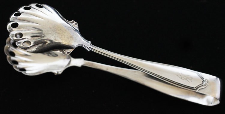 The Sterling Silver Mfg. Co Ice Tongs: Est $ 90-140 Ice Tongs monogrammed with the letter S, marked The Sterling Silver Mfg. Co and sterling. Measures 6 1/4" long and weighs 1.5 ozt.