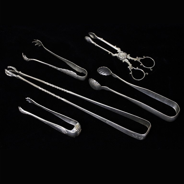 Set of 5 Miscellaneous Silver Tongs: Est $ 100-200 Set of 5 tongs 1) Large pickle tongs with spiral twist handles monogrammed with a D and marked J.E. Caldwell & Co. The tongs measures 10" long. 2) Ice Tongs marked E. Mead & Co. along wi