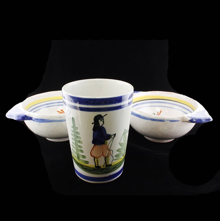 Set of Three Handmade Quimper Faience: Est 100-200 Three handmade Quimper Faience. Two porringers signed on the bottom Henriot Quimper with paintings of a peasant man and the other a women. 5 5/8" w x 2 1/8" t. The cup is signed HB Quimper