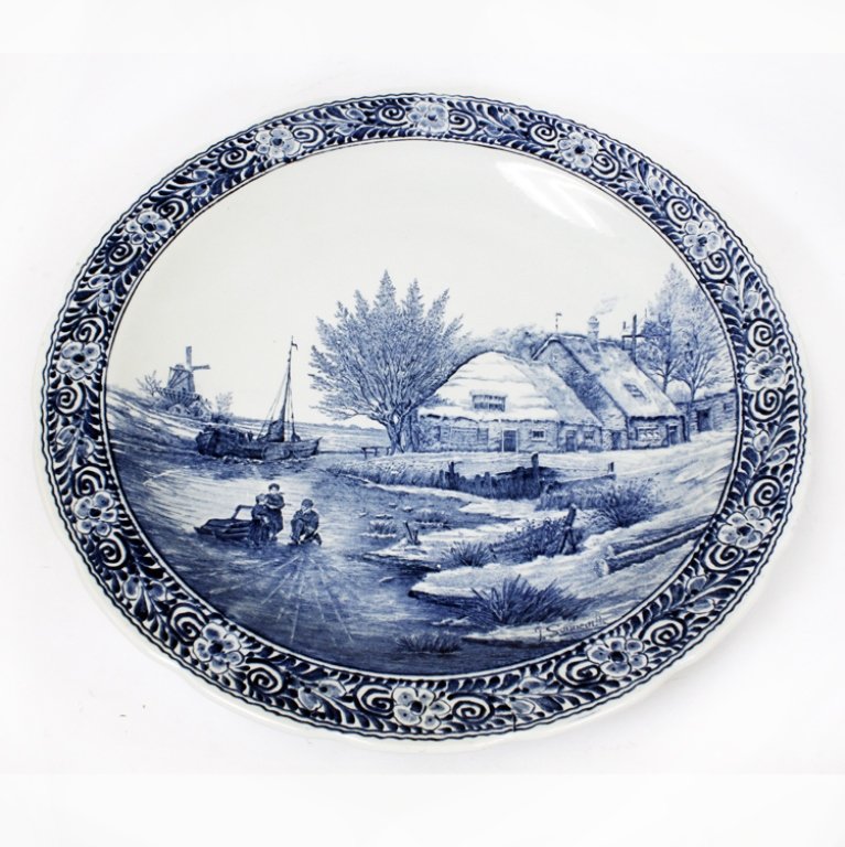 Large Boch Belgium Royal Sphinx Delfts: Est $ 100-200 Large delfts wall hanger/ charger plate. Marked on the back "Made for Royal Sphinx by Boch Belgium", "Holland", "Delfts". The plate has a floral boarder around a scenic motif of a house,