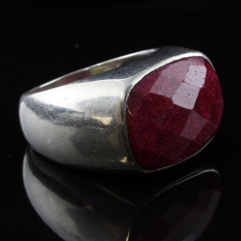Sterling Ruby Ring: Est. $ 40 - 60 Sterling Ruby Ring 14.3 gr tw. Stone measures .75" x 1". Marked AB, 925, India