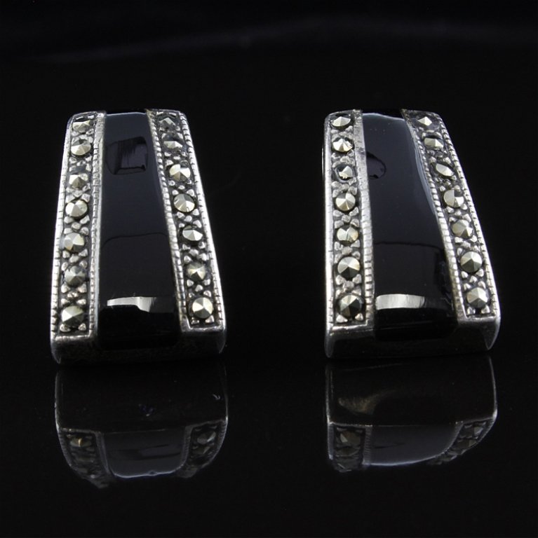 Sterling Marcasite and Onyx Earrings: Est. $15 - 30 Sterling Marcasite and Onyx Earrings. Weighs 6.5 grams. Post style.
