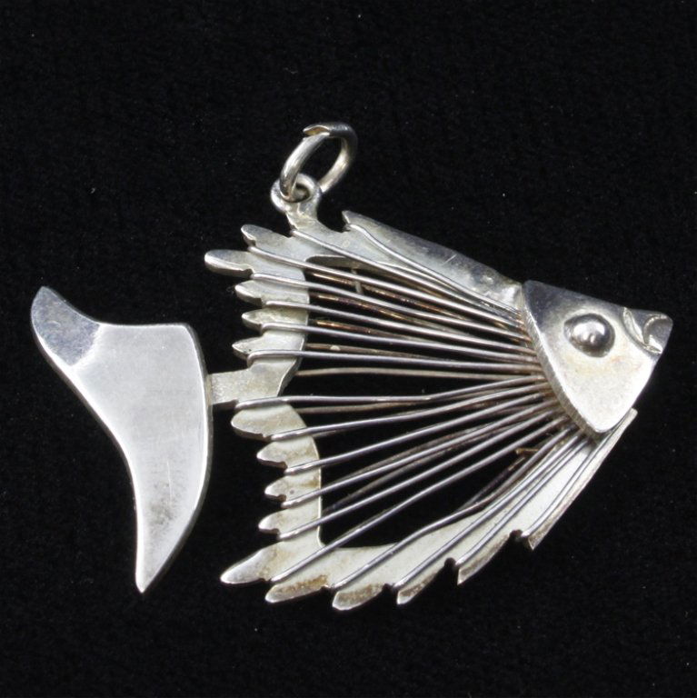 Modern Fish Sterling Pendant: Est. $30 - 50 Modern Fish Sterling Pendant. 5.3 grams. Fish design with wire body. No marks. 1 1/2 X 1 1/8".
