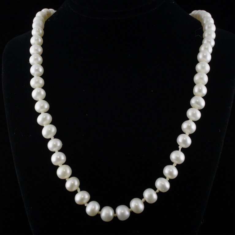 Pearl Necklace with Yellow Gold and Sterling: Est. $ 200 - 300 Pearl Necklace with Yellow Gold and Sterling 18k yellow gold & sterling clasp and hardware. Oval button drop shaped white. 19" long. Marks: 18k, 925, DS.