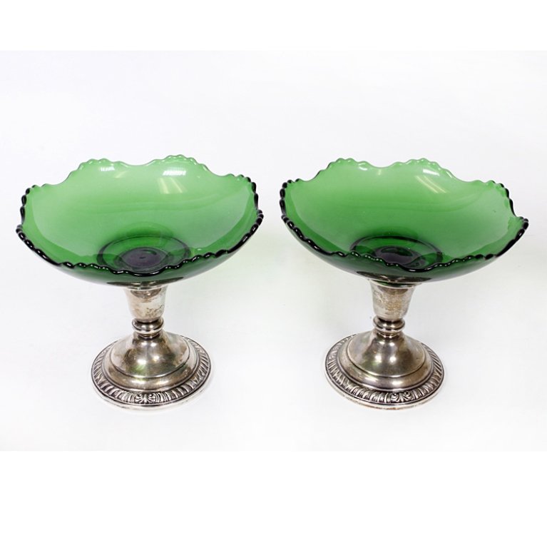 Frank M. Whiting Sterling & Glass Compotes: Est $ 100-200 Two matching compotes with scalloped glass bowls in forest green and are threaded to fit down into candlestick holders marked "Frank M. Whiting, Sterling, Weighted and Reinforced". They 