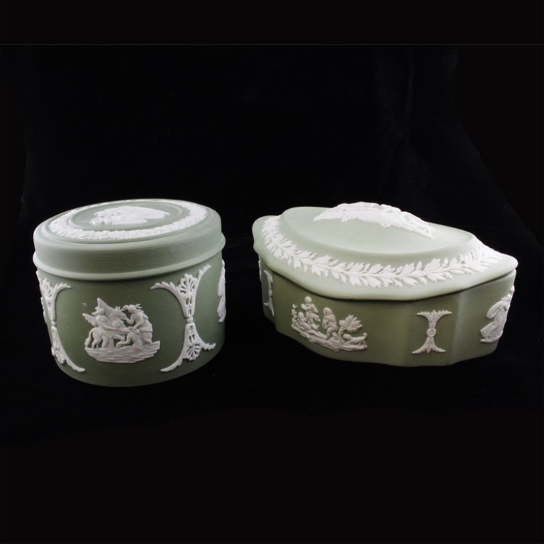 Set of Two Green Wedgwood Jasperware Ceramics: Est $ 100-200 Set of two green Wedgwood Jasperware ceramics including: 1) One green and white cherub motif Wedgewood Jasperware tinket box, measures 4 3/8" in length 2" x tall x 3 1/4" wide. 2) One We