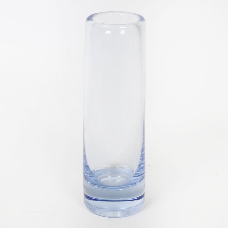 Per Lutken Holmegaard Art Glass Cylindrical Vase: Est $ 100-250 Cylindrical light blue vase designed by Per Lutken and signed underneath "Holmegaard 220285". The vase measures 6 3/4" tall. Third party shipping.