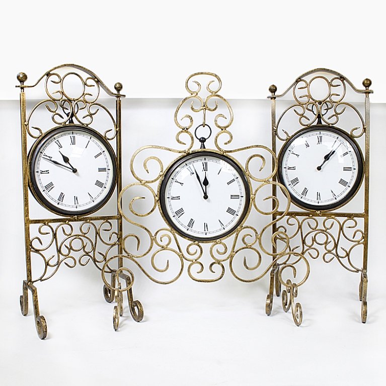 Lot of Metal Decorative Clock Hangers: Est. $ 50-75 Lot of Metal Decorative Clock Hangers. Ornate styled clock hangers. Gold tone paint. One measures 20 inches x 23 inches tall. (2) measures 9.5 inches by 24 inches tall.
