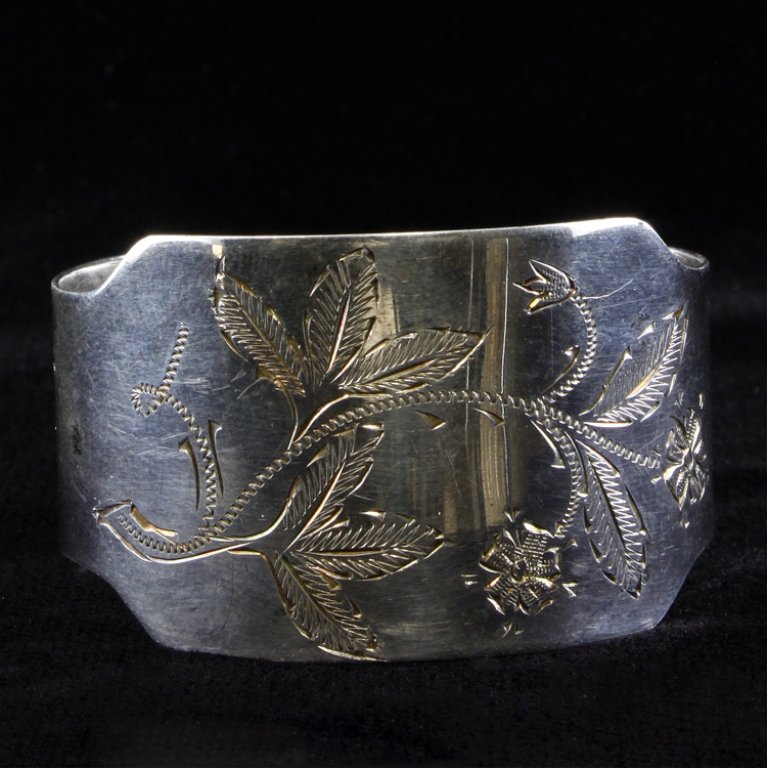 Swedish Silver Napkin Ring: Est. $30 - 50 Bright cut etched napkin ring, marked "Mema, bear the silver standard marked and the date mark 1961" monogrammed "A.-M.". The napkin ring measures 1 5/8" in diameter x 1" tall and weighs