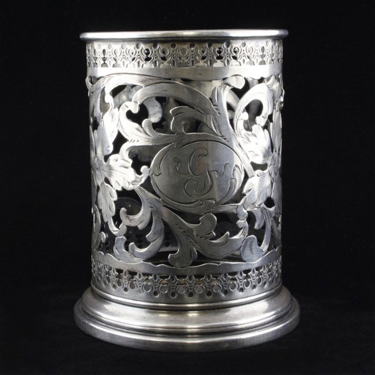 Sterling George A. Henckel & Co. Wine Coaster: Est. $80 - 120 Sterling George A. Henckel & Co. Wine Coaster, marked "Sterling, 1025 and monogrammed with the letter G, the wine coaster measures 3 5/8" tall x 2 7/8" in diameter and weighs 2.3 ozt.