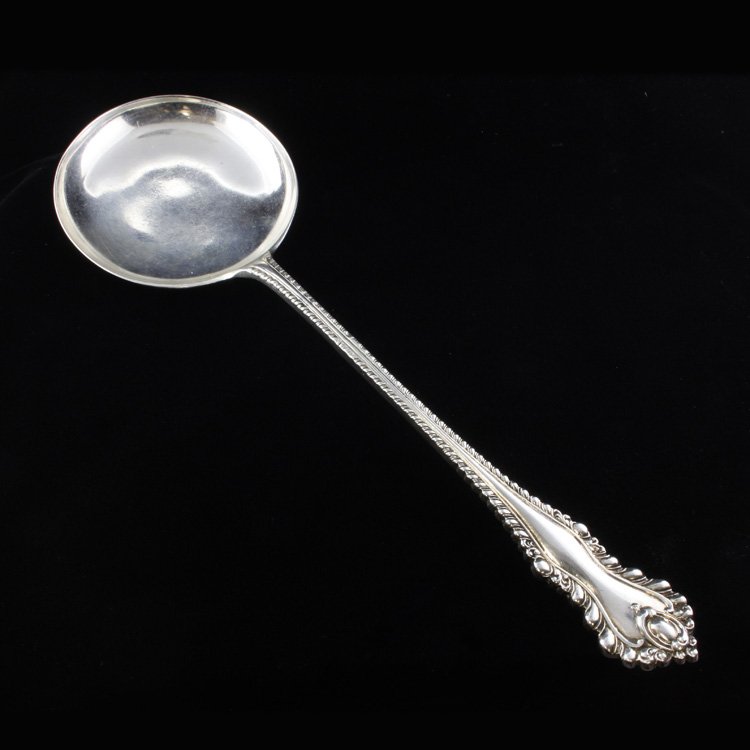 William Gibson & John Langman Serving Spoon: Est. $100 - 140 Large serving spoon marked with the "William Gibson & John Langman" mark and bears the 1896 date mark. The spoon measures 9 1/4" long and weighs 3.2 ozt.