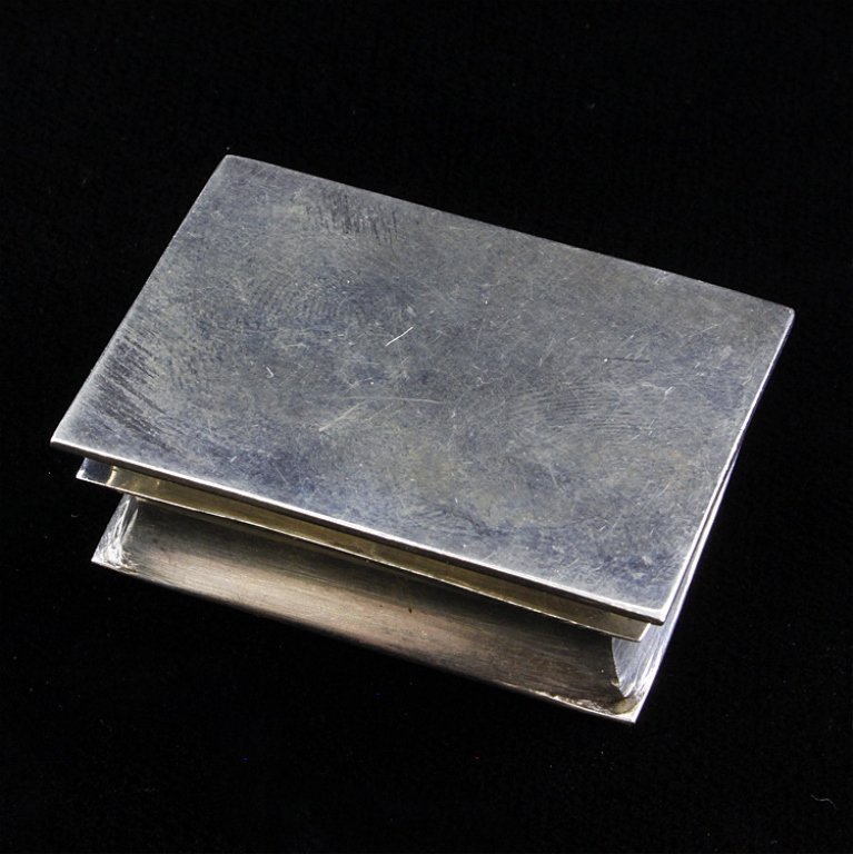 Small Sterling Mexican Trinket Box: Est. $50 - 60 Small trinket box with a hinged lid. It is marked underneath "Mexico, TJ-62, 925". The box measures 1 5/8" wide x 1/2" tall and weighs 1.05 ozt.