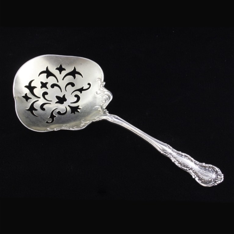 Wallace Irving Sterling Bon Bon: Est. $20 - 45 Bon bon spoon with the 1899 Irving pattern with a light gold washed bowl. The spoon is marked "Wallace, Sterling and Pat. 1899", it measures 5" long and weighs .54 ozt.