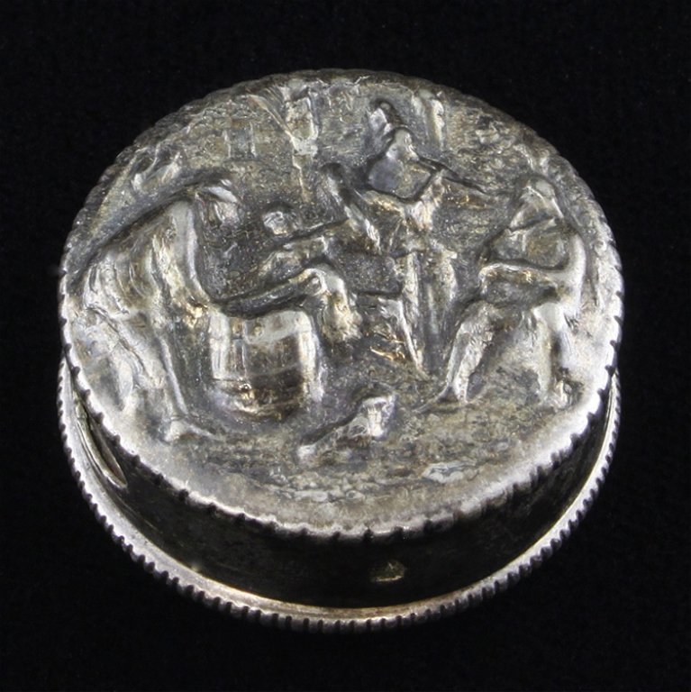 Vintage Silver Denmark Snuff Box: Est. $25 - 50 Vintage Silver circular snuff box marked "Made in Denmark". It has a repousse design on the lid, It measures 1" in diameter and 3/8" tall and weighs .25 ozt.