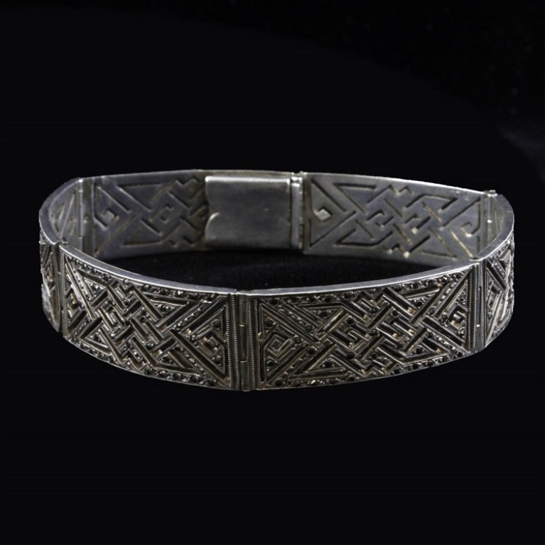 Sterling and Marcasite Fashion Bracelet: Est. $30 - 45 Sterling and Marcasite Fashion Bracelet. Measures 7.5 inches long and .5 inches wide. Weighs 28.6 grams.