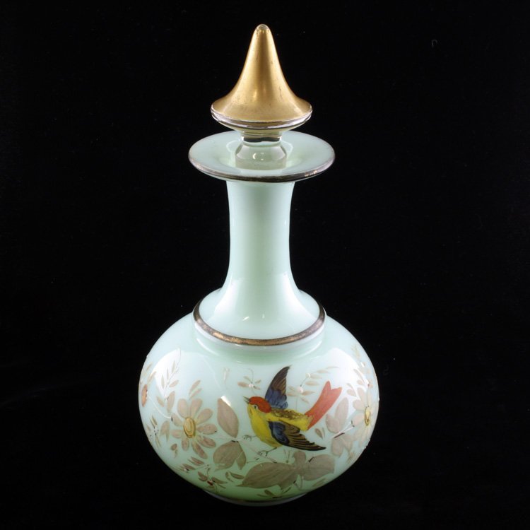 Vintage Opaline Hand Painted Bottle: Est. $150 - 300 Vintage Opaline Hand Painted Bottle. Green opaline glass bottle with a bird and floral hand painted motif with enamel accents. The bottle has gold painted accents and a gold painted st