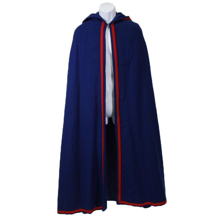 1960s Royal Blue Cape with Hood: Est. $75 - 100 1960s royal blue cape with hood. This cape is made of blue wool that is trimmed in red and black twill. It has a hood. It is totally lined in blue cotton. The shoulders are 17, and the 