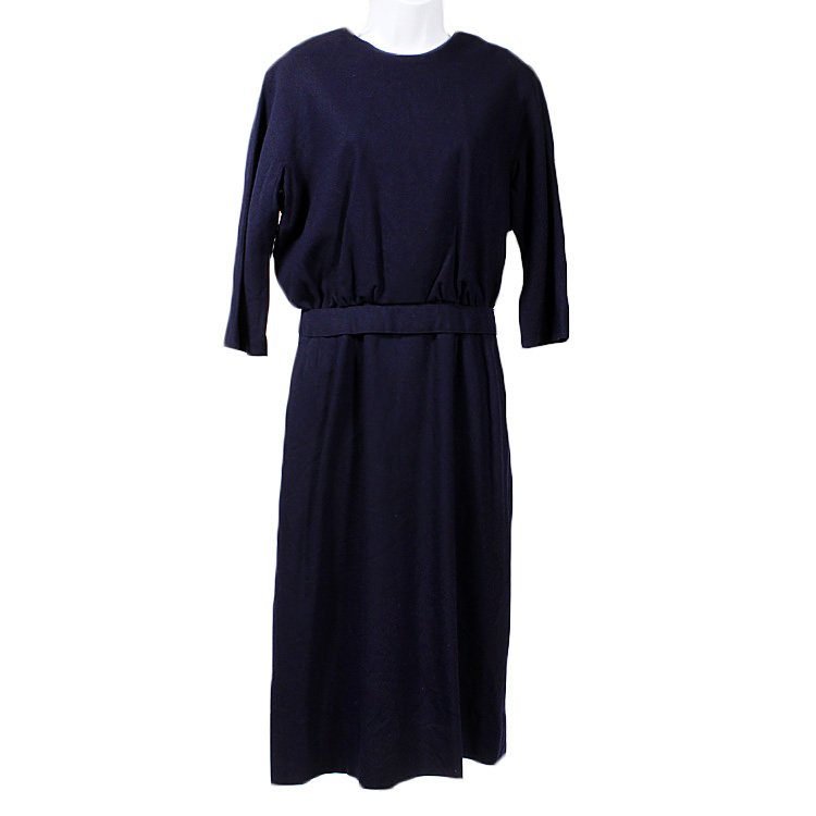 1950s Robert Fashions Navy Wool Dress: Est. $20 - 30 1950s Robert Fashions Navy Wool Dress Fully lined mid-weight navy wool dress with belt by Robert Fashions. Lining is torn and small hole near kick pleat in back of skirt. Batwing 3/4 len