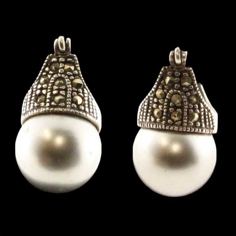Sterling Marcasite Earrings: Est. $10 - 20 Sterling Marcasite Earrings. Weighs 6.1 grams. Faux pearls.