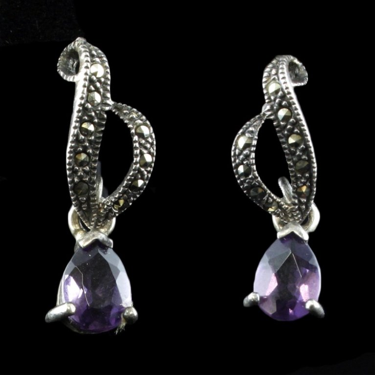 Amethyst Marcasite and Sterling Earrings: Est. $20 - 30 Amethyst Marcasite and Sterling Earrings. Weighs 3.5 grams. Post style.