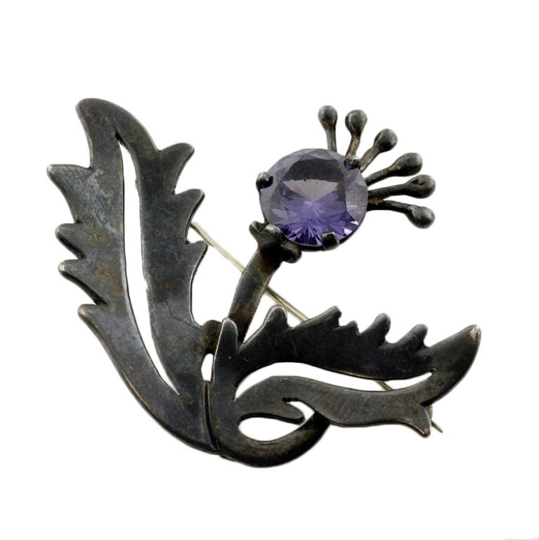 Miguel Melendez Faux Alexandrite Sterling Brooch: Est. $45 - 60 Miguel Melendez Faux Alexandrite and Sterling Brooch. Weighs 14 grams. Measures 2 inches across. Marked Taxco, "m" for Miguel Melendez, Made in Mexico.
