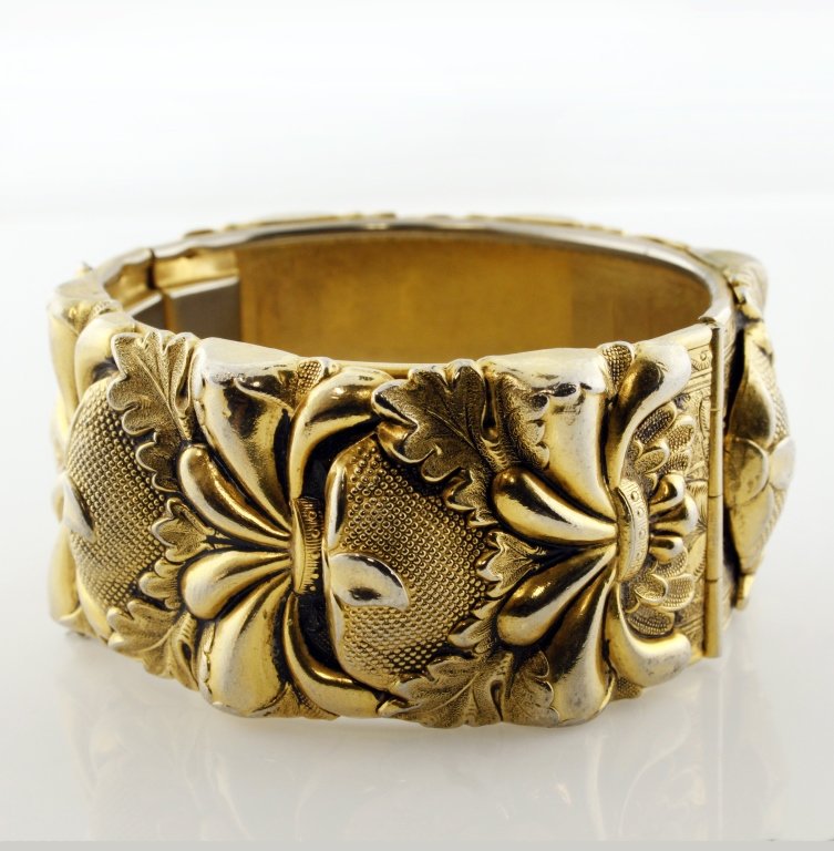 Vtg. Vargas Bracelet: Est. $30 - 40 Vtg. Vargas Bracelet. Vargas marked hinged bracelet with safety chain approx. 2 1/2 " interior diameter and 1 1/2" wide. Gold tone.
