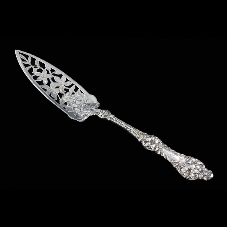 Rare Alvin Sterling Old Orange Blossom Cake Server: Est. $500 - 750 Rare Alvin Sterling Old Orange Blossom Cake Server. Weighs 2.19 ozt. Alvin Sterling old Orange Blossom jelly or cake server with floral repousse. Blade engraved and pierced, very rare 
