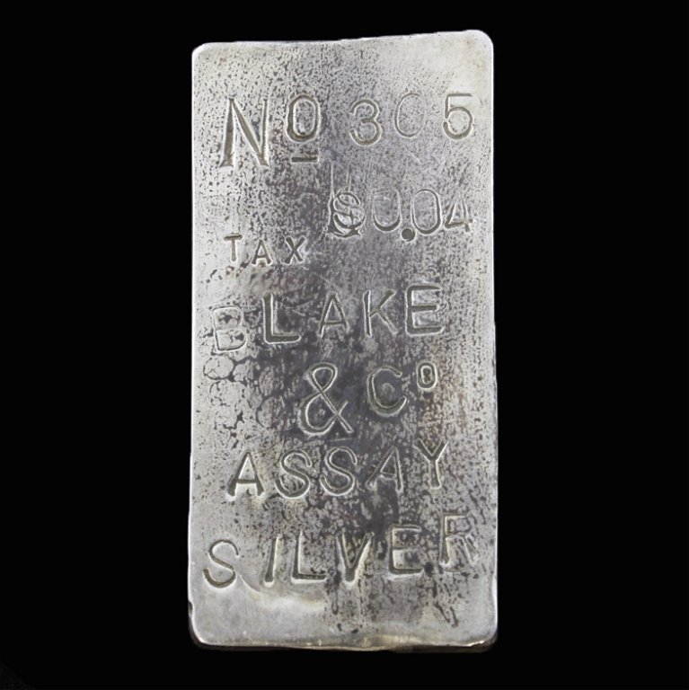 Antique Silver Bullion: Est. $50 - 75 Antique Silver Bullion. Marked No. 305, Tax $0.04, Blake & Co. Assaye Silver on front and Jan 5.85 on back. Weighs 0.635 ozt.
