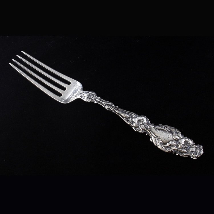 Sterling Whiting Lily Lunch Fork: Est. $50 - 75 Sterling Whiting Lily Lunch Fork. Weighs 1.44 ozt. Gothic monogram. Measures 6.75 inches.