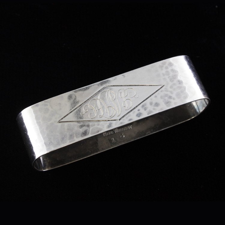 American Silver Hammered Sterling Napkin Ring: Est. $30 - 45 American Silver Hammered Sterling Napkin Ring . Weighs 0.85 ozt. Marked handwrought. Measures 2.75 inches.