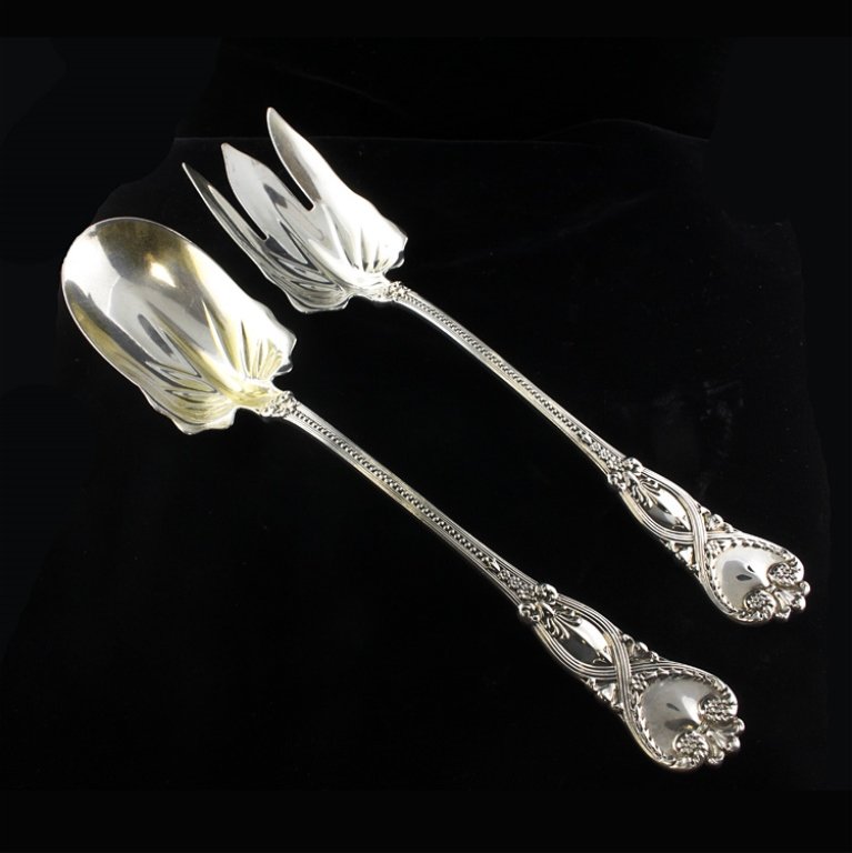 Tiffany St. James 2 Pc. Sterling Serving Set: Est. $650 - 975 Tiffany St. James 2 Pc. Sterling Serving Set. Weighs 7.03 ozt. St. James pattern large salad serving set. Two pieces, one fork and one spoon. Each are 10 inches long.