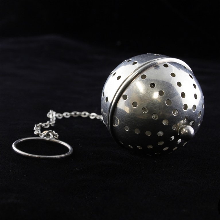 Sterling Tea Ball Infuser: Est. $10 - 15 Sterling Tea Ball Infuser. Weighs 0.3 ozt. Sterling chain and ball. Measures 1.25 inches.